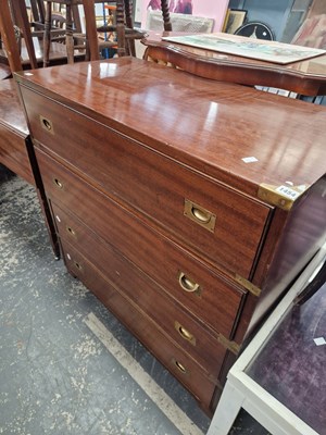 Lot 1454 - A campaign type brass bound chest of drawers