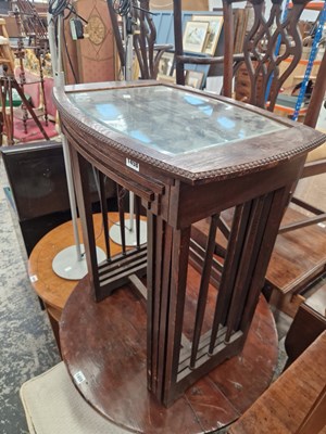 Lot 1458 - A nest of four oak & glass top occasional tables.