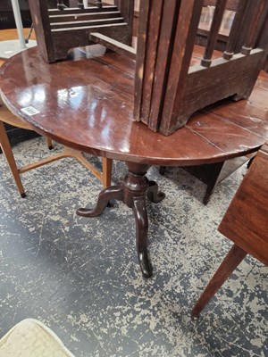 Lot 1459 - An early yew wood country tripod table.