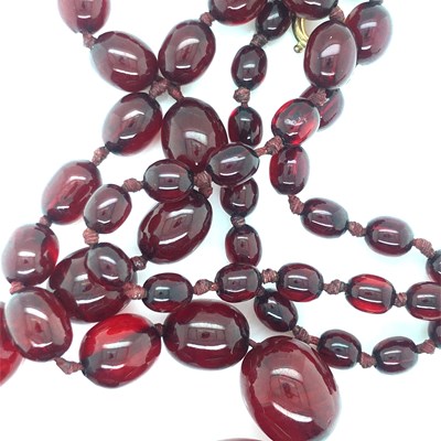 Lot 170 - A graduated string of cherry red graduated...
