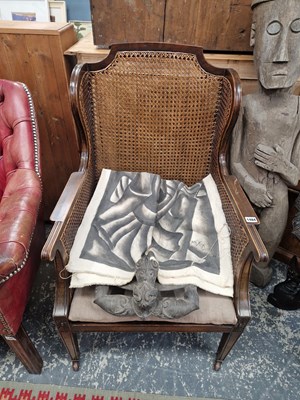 Lot 1484 - An early 20th century caned bergere wing back...