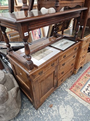 Lot 1488 - An oak dresser of four drawers and a single...