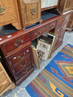 Lot 1495 - A mahogany twin pedestal desk.