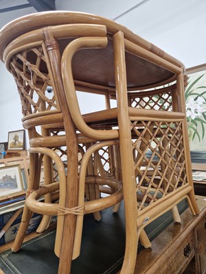 Lot 1498 - A small conservatory table and two chairs.