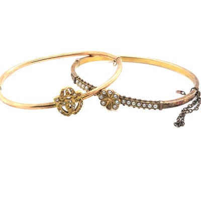Lot 180 - Two antique gold and seed pearl bangles,...
