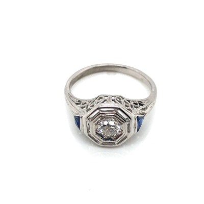 Lot 183 - A vintage diamond and sapphire ring. The old...
