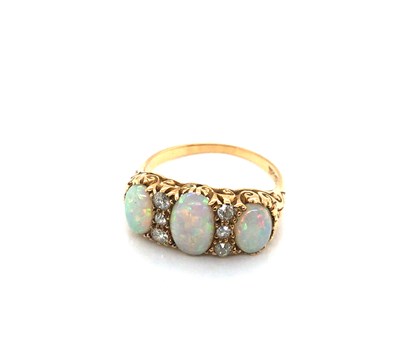 Lot 184 - A vintage 18ct gold stamped opal and diamond...