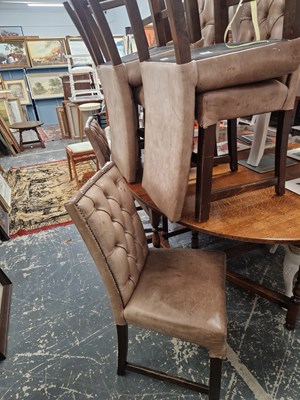 Lot 1569 - A set of eight leather upholstered dining chairs.