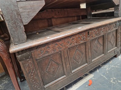 Lot 1583 - An 18th century oak panel front coffer.