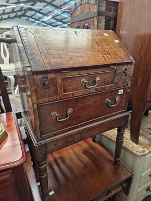 Lot 1590 - An early 18th century small ladies oak bureau...