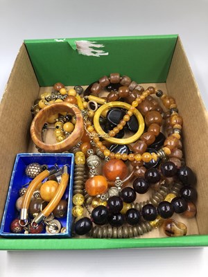 Lot 188 - A row of cherry red beads weight 102 grams,...