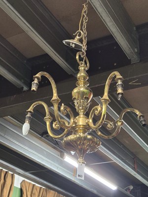 Lot 963 - A brass five arm chandelier