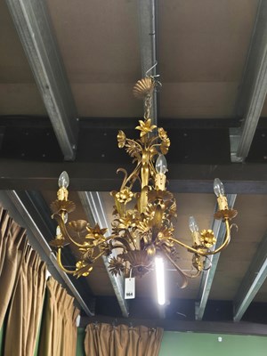 Lot 964 - A gilt tolware six arm chandelier