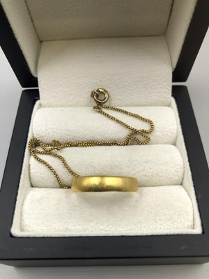 Lot 200 - A 22ct hallmarked gold wedding ring, and a...