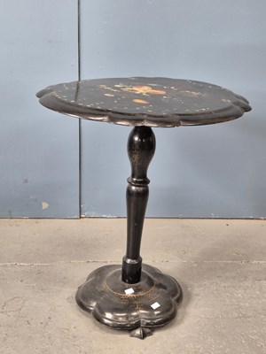 Lot 940 - A Victorian papier mache tilt-top table.