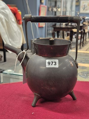 Lot 973 - An arts and crafts copper kettle.