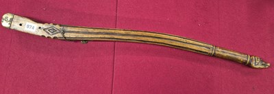 Lot 974 - An antique hand-carved walnut boat tiller.