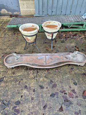Lot 750b - A fire fender and two pottery planters on stands.