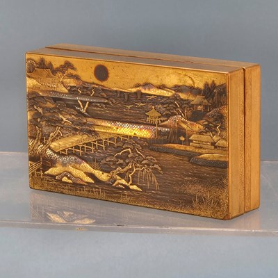 Lot 212 - A Japanese lacquer box containing three other...