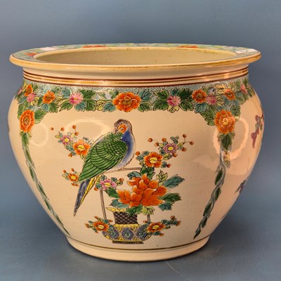 Lot 215 - A Japanese porcelain planter painted with...