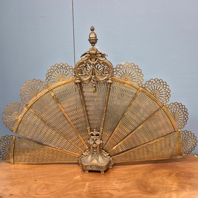 Lot 216 - A brass fire screen of eight pierced leaves...