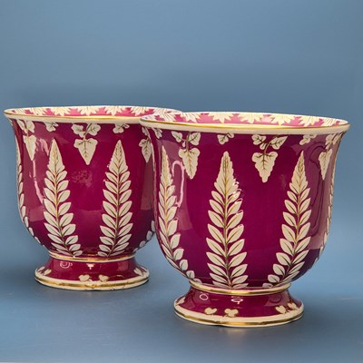 Lot 228 - A pair of purple ground pottery planters, the...