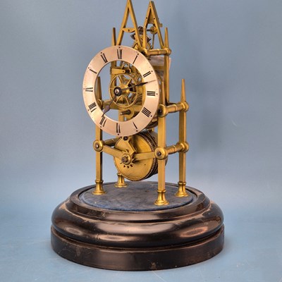 Lot 237 - A fusee skeleton clock under a dome on an...
