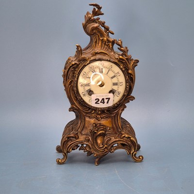 Lot 247 - A rococo foliate ormolu cased mantel clock...
