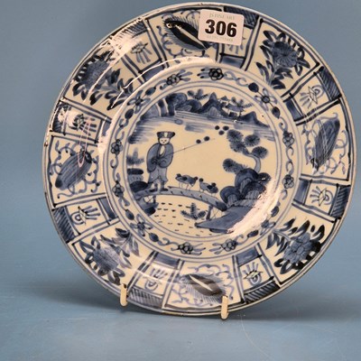 Lot 306 - A 17th century Arita dish painted with a man...
