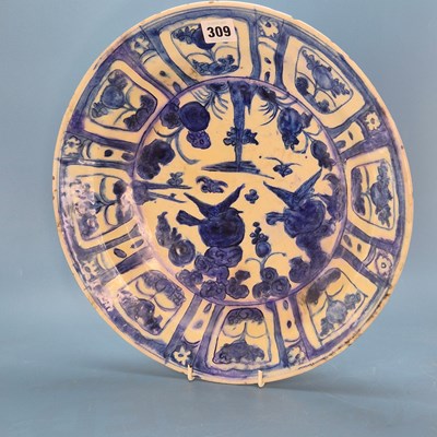 Lot 309 - A 17th-century Iranian blue and white pottery...