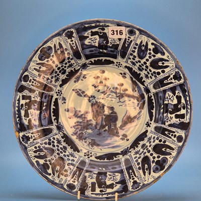 Lot 316 - An 18th century Delft blue and white dish, the...