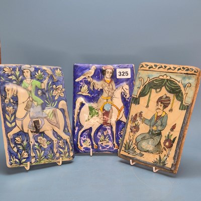 Lot 325 - Four various Qajar relief moulded polychrome...