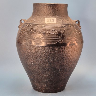 Lot 333 - A Chinese cast iron two handled vase with a...