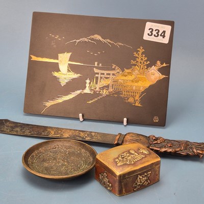 Lot 334 - A Japanese iron plaque inlaid in silver and...