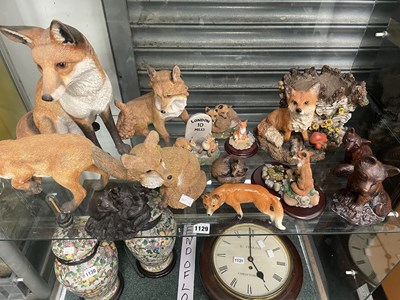 Lot 1129 - A collection of composition fox figurines