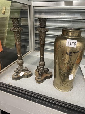 Lot 1136 - A pair of bronze classically cast candlesticks....