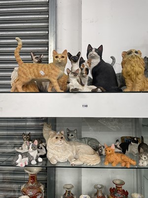 Lot 1140 - A collection of cat figurines by Leonardo...