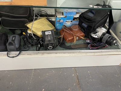 Lot 1145 - A Canon EOS 500 and other cameras