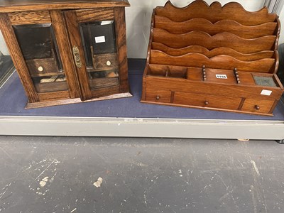 Lot 1156 - A glazed oak smoking compendium with some...