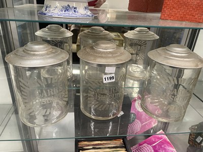 Lot 1199 - Three named glass storage jars with aluminium...