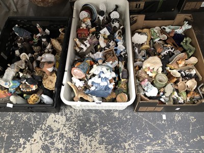 Lot 1242 - A collection of composition and ceramic animal...