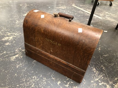Lot 1254 - An oak cased sewing machine