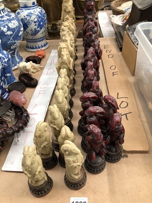 Lot 1260 - A red and white composition animal form chess set