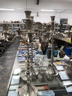 Lot 1314 - A set of three chrome five light candelabra