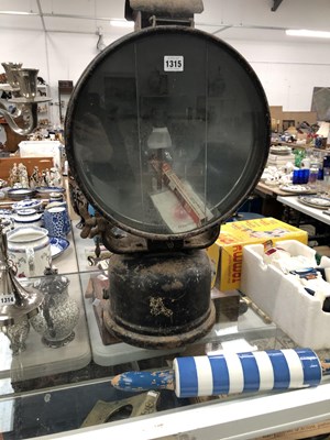 Lot 1315 - A Tilley-Hendon paraffin search light with a...