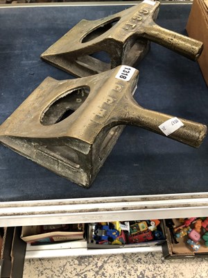 Lot 1318 - A pair of bronze wheel chocks cast with the...