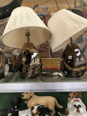 Lot 1328 - A pair of Poole Pottery copper lustre table lamps