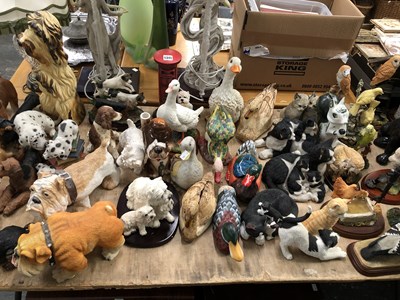 Lot 1345 - Composition and pottery dogs, ducks, other...