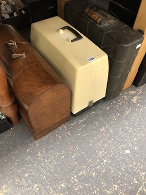 Lot 1354 - A wooden and a plastic cased sewing machine...