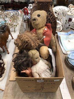 Lot 1452 - Four dolls, a teddy bear and a pierced iron...